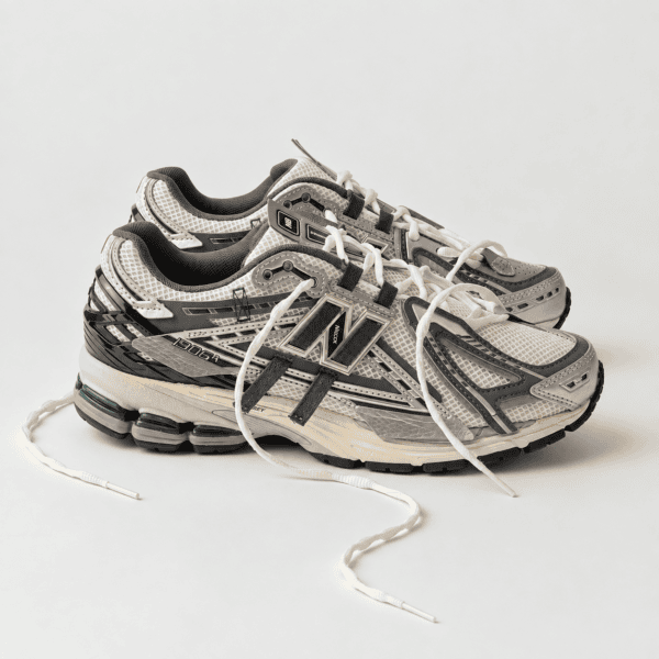 New Balance 1906 Mesh-Panel Sneakers in grey and black with white accents.