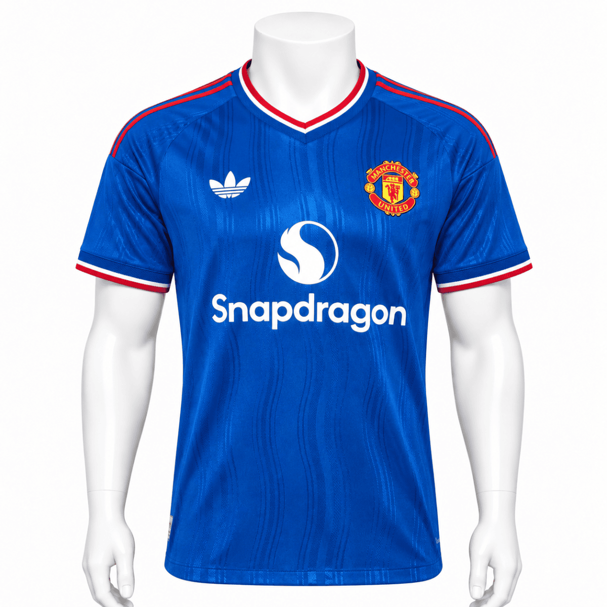 Manchester United away player jersey 2026/27 in blue with red and white accents.