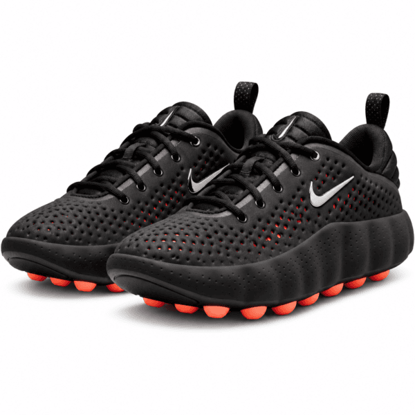 Black Nike running shoes with red accents and perforated upper.