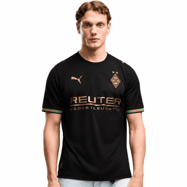 252d97e5-13e6-4197-95fa-7a8d202c543cpng - UAE SPORT STORE Black Borussia Mönchengladbach football jersey with gold accents and sponsor logo.