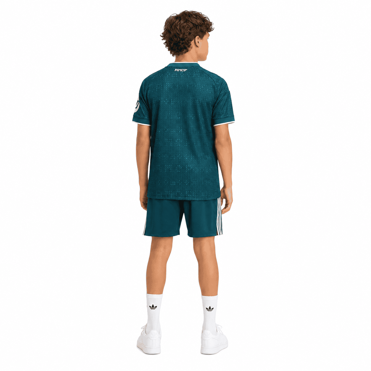 3c645364-8dc6-40ab-8c62-43ecf58427be - UAE SPORT STORE Child wearing Real Madrid away kit 2026/27 in blue, back view.