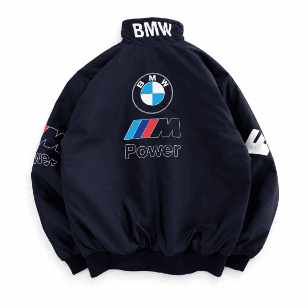 BMW M Power logo on a navy blue BMW jacket with sponsor and brand patches.
