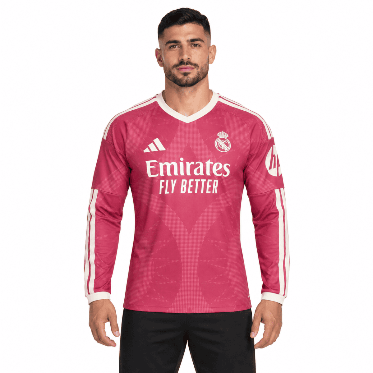 Real Madrid 2023 home football jersey pink with white accents and sponsor logo.