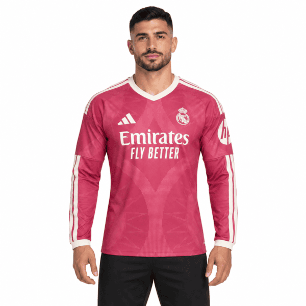 4710fa9e-b1ac-4548-8d5f-d7e8b527d87b - UAE SPORT STORE Real Madrid 2023 home football jersey pink with white accents and sponsor logo.