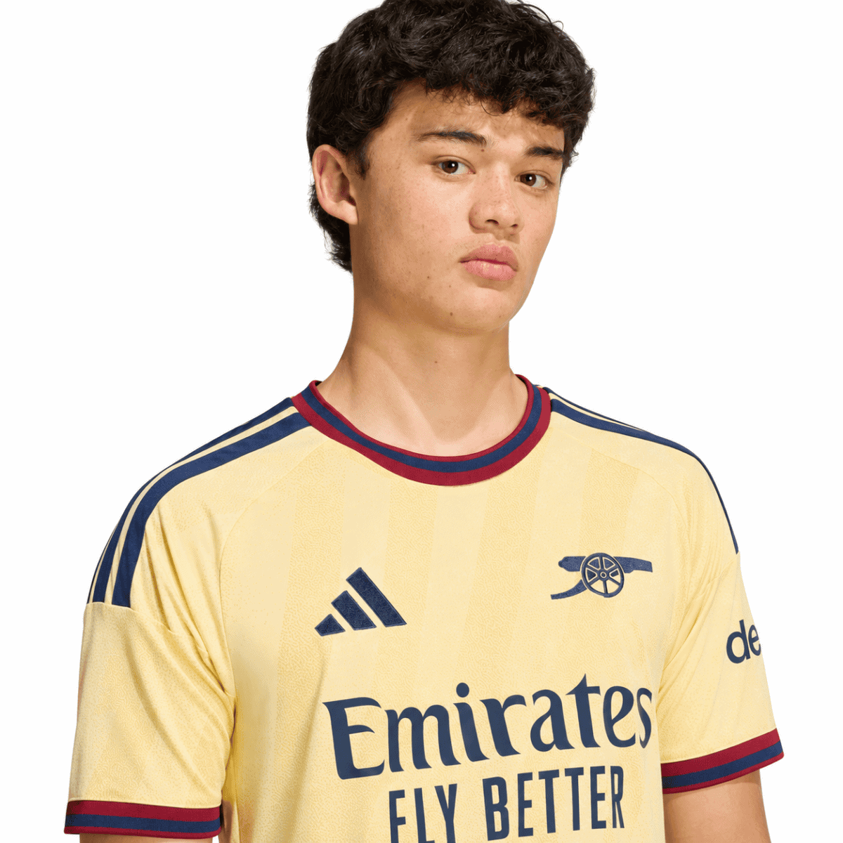 Arsenal third jersey 2026/27, yellow with navy and red accents, Adidas logo.