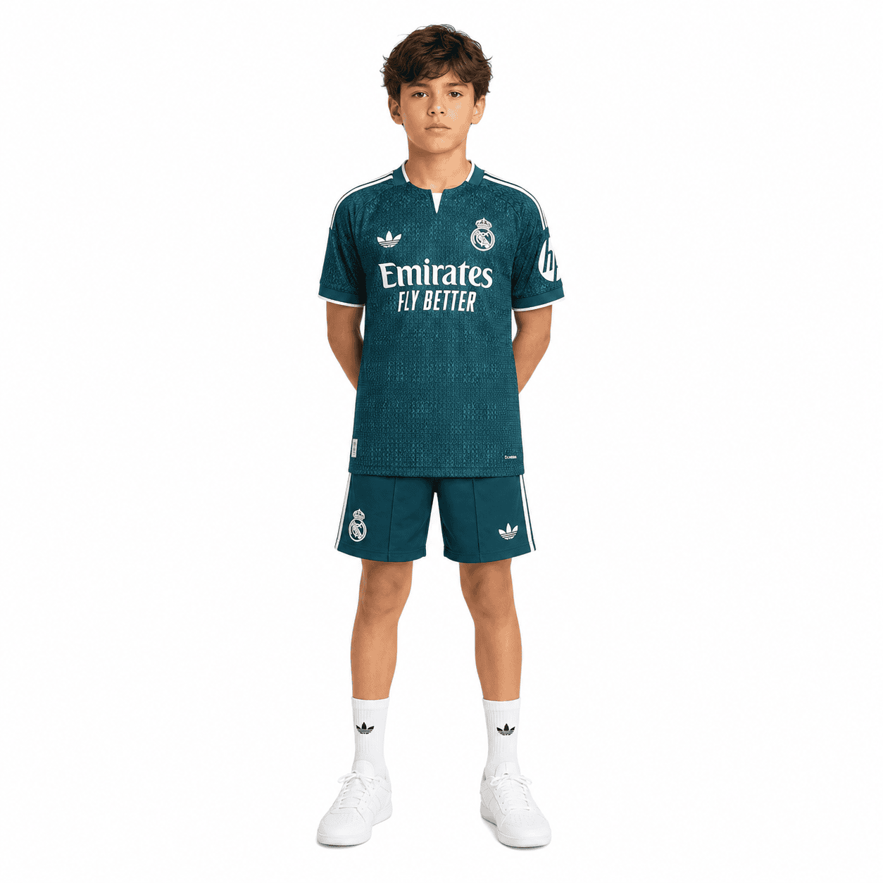 4af2e770-e562-46ba-b8d7-4e31d3e54dd2 - UAE SPORT STORE Real Madrid kids away kit 2026/27, teal jersey and shorts, white socks, front view.