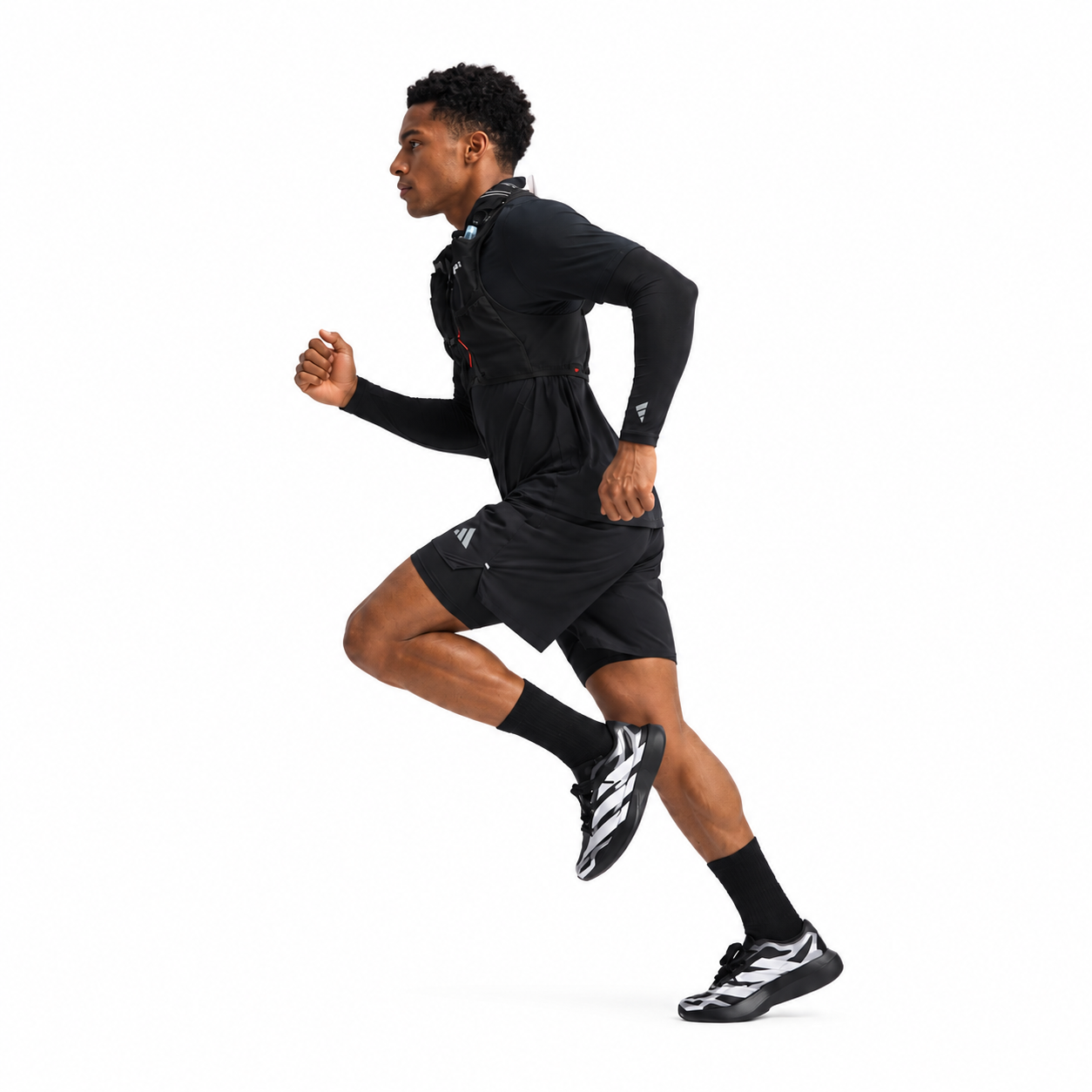 4df8d93a-f98b-41ea-ae40-61405e37af02 - UAE SPORT STORE Male athlete in black running outfit with backpack, mid-stride, on white background.
