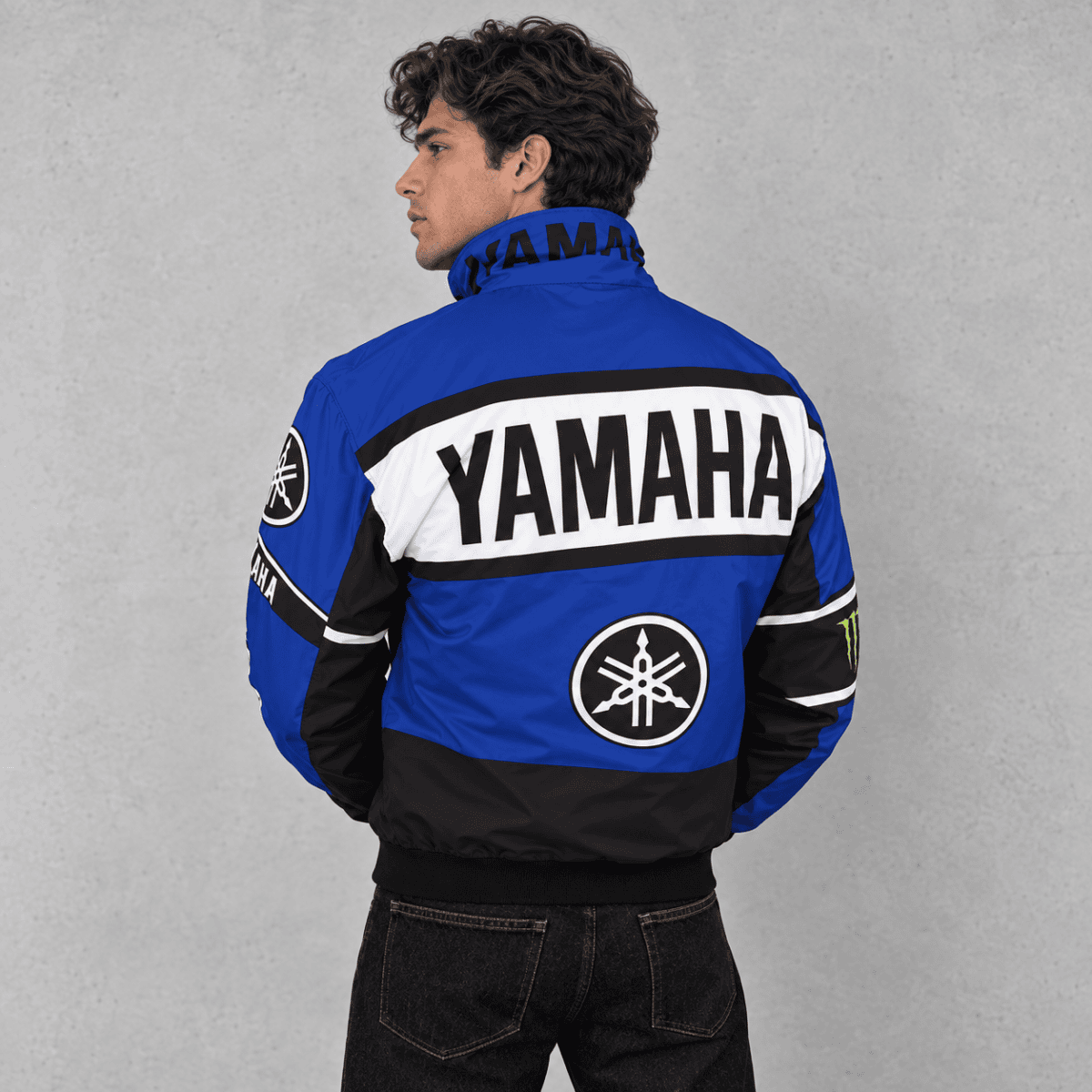 Yamaha racing jacket in blue, black, and white with Yamaha logo and branding.