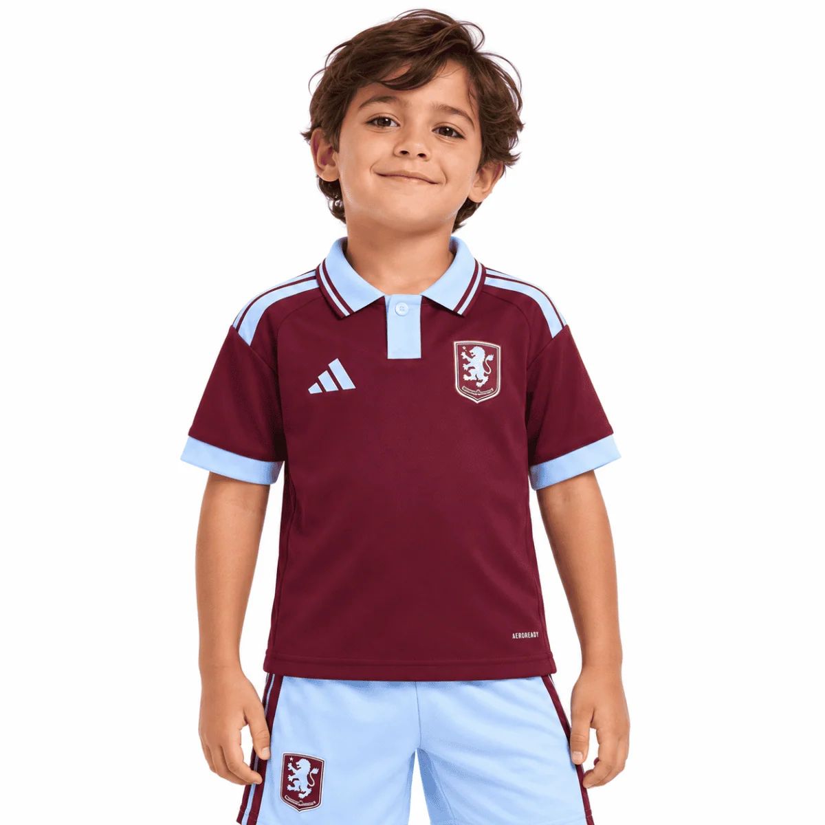 Child wearing Aston Villa home kids football kit 2026/27 with maroon and light blue colors.