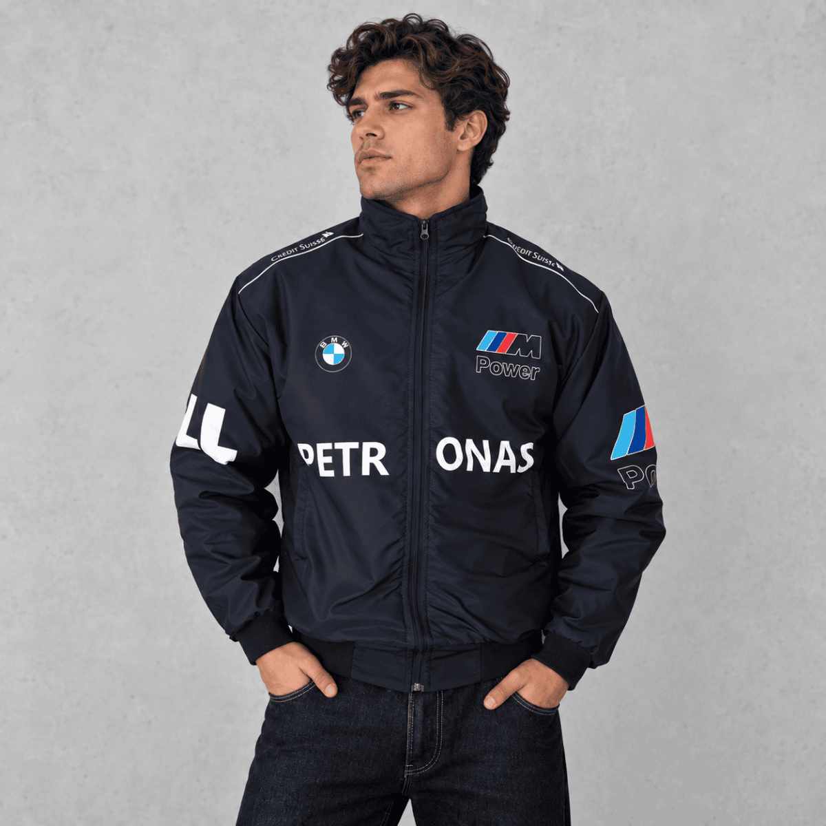 BMW M Power racing jacket in navy blue with sponsor logos and patches.
