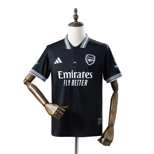 Arsenal away football jersey with Emirates sponsor and club crest.