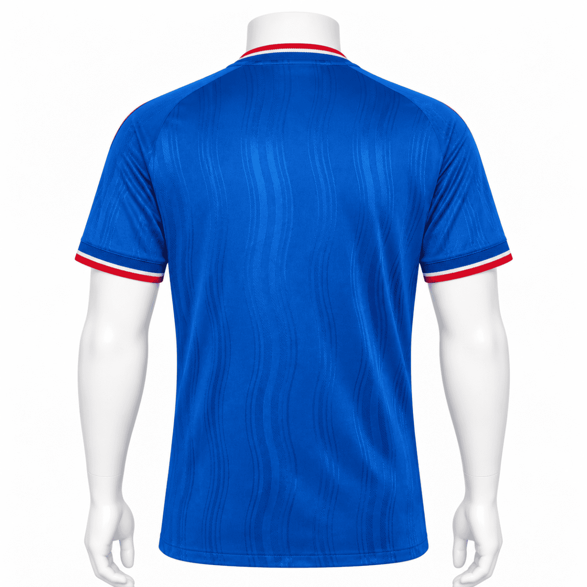 Manchester United away jersey 2026/27 in blue with red and white trim.