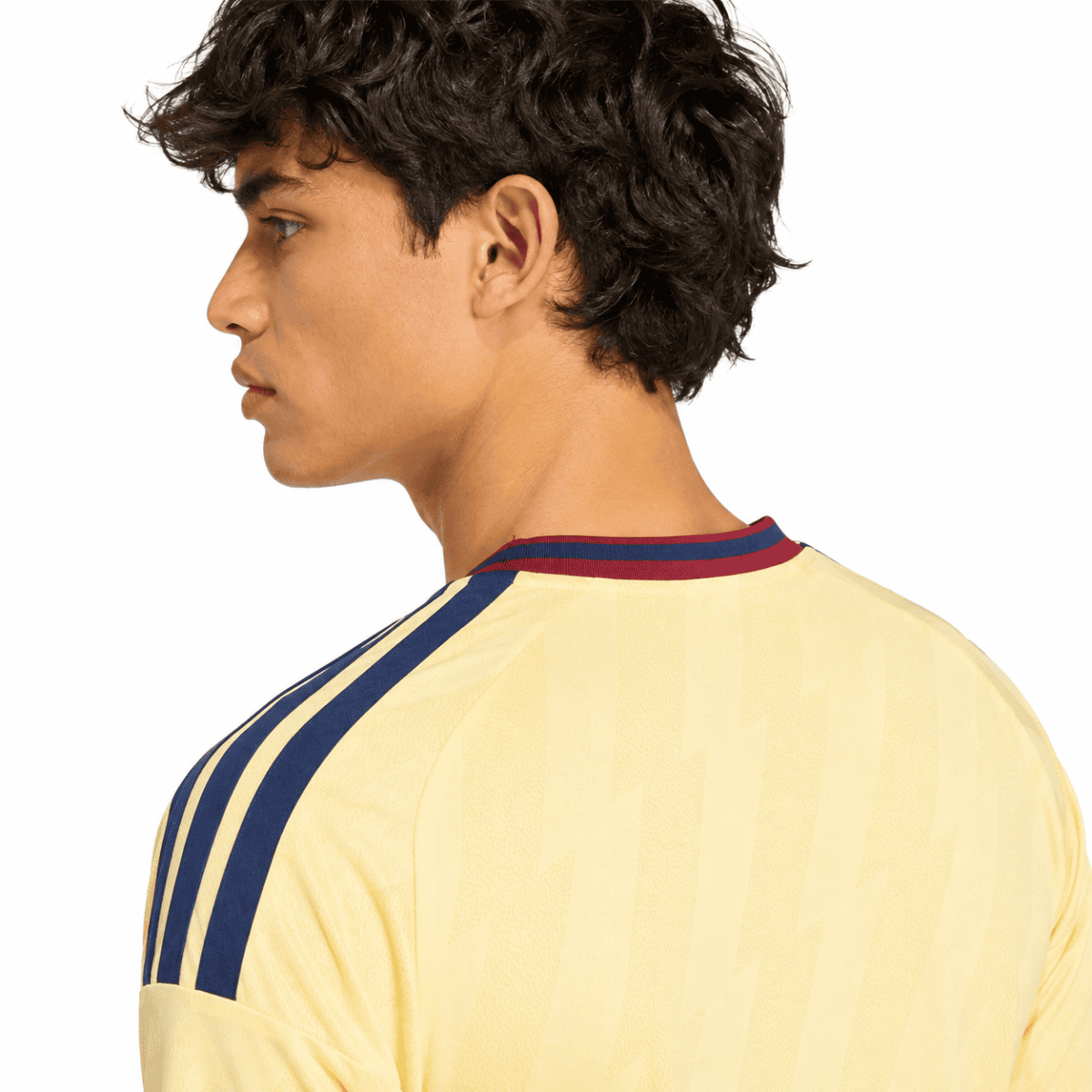 Gunners third jersey 2026/27 with yellow and blue colors, seen from the back.