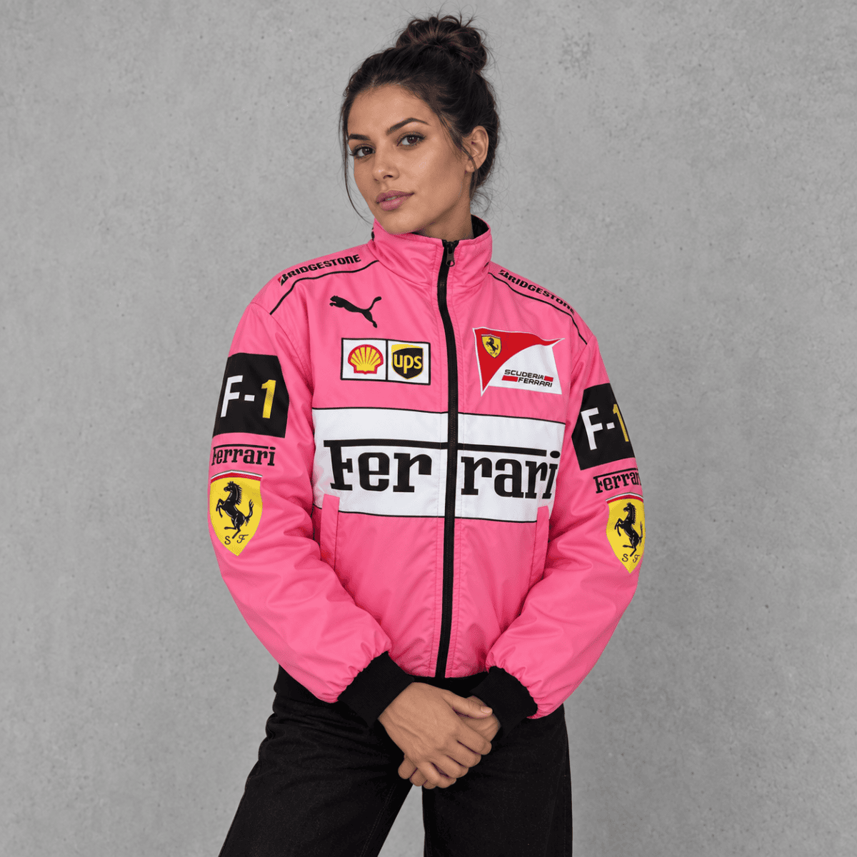 Pink Ferrari Formula 1 team jacket with sponsor logos and black cuffs.