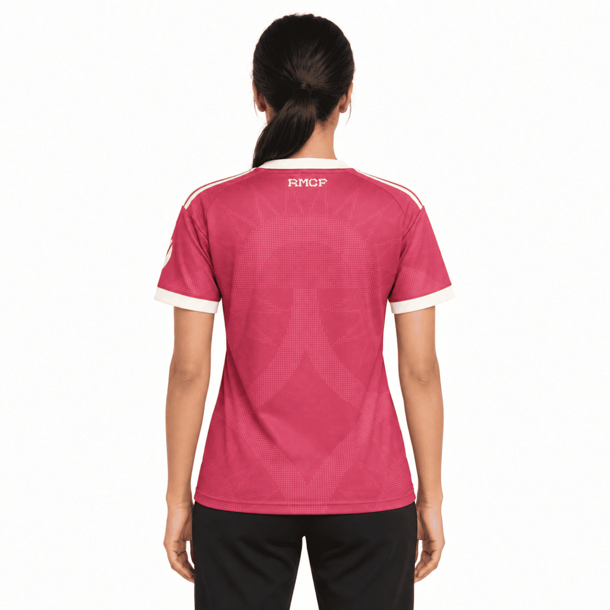 Back view of a pink football jersey with white accents and 'RMCP' text on the back.