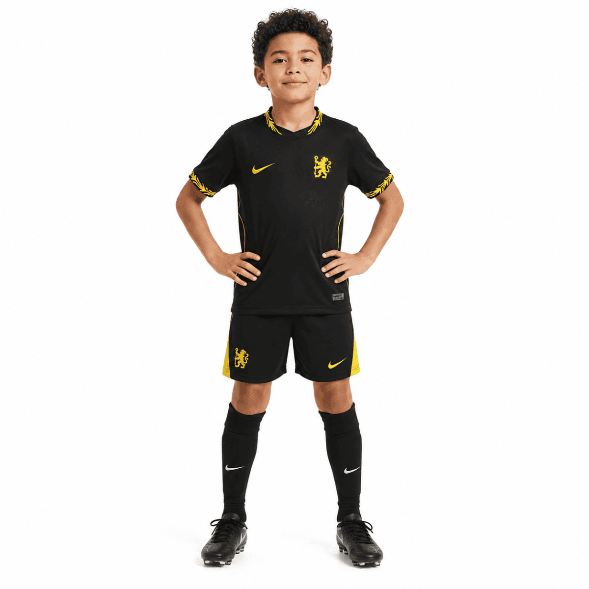 Child wearing Chelsea Kids Away Kit 2026/27, black with yellow accents.