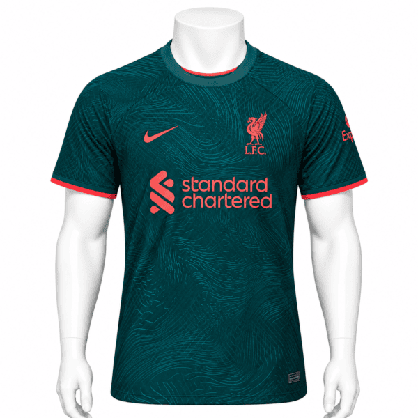 7a67490b-0402-4e11-bca8-95b4e559e523 - UAE SPORT STORE Liverpool third kit 2022/23 jersey in teal with red logos and accents.