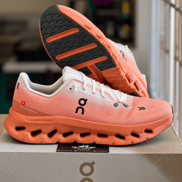 8 - UAE SPORT STORE On Running Cloudtilt Ivory Canyon running shoes with orange sole details.