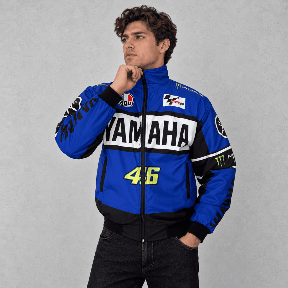 Yamaha racing jacket in blue, black, and white with sponsor logos and number 46.