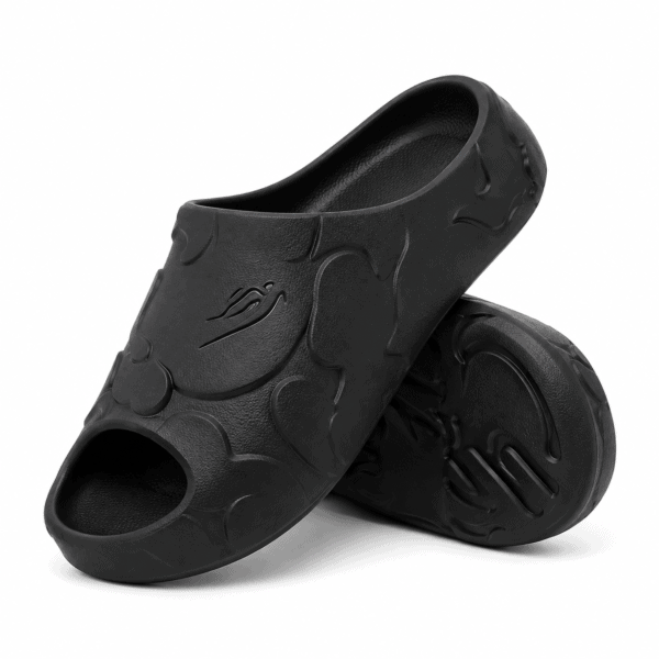 82e38193-eadf-481e-af5c-2c4bfaf942f7 - UAE SPORT STORE Black BAPE slides with shark design and logo on top.