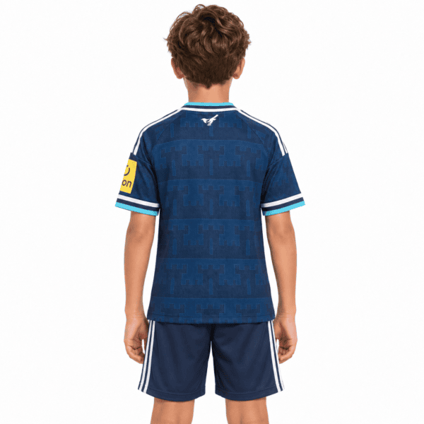 Newcastle United away kids kit 2026/27 in blue with club crest and sponsor logo.