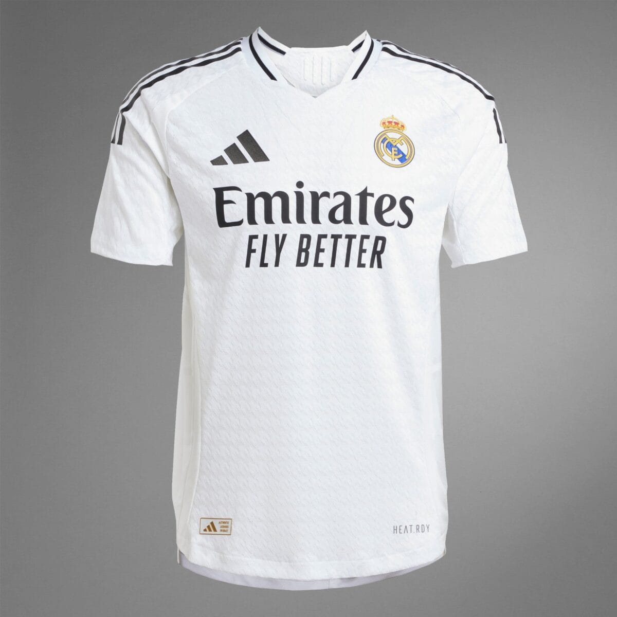 Real Madrid away kit 2023 white jersey with black accents and logo.