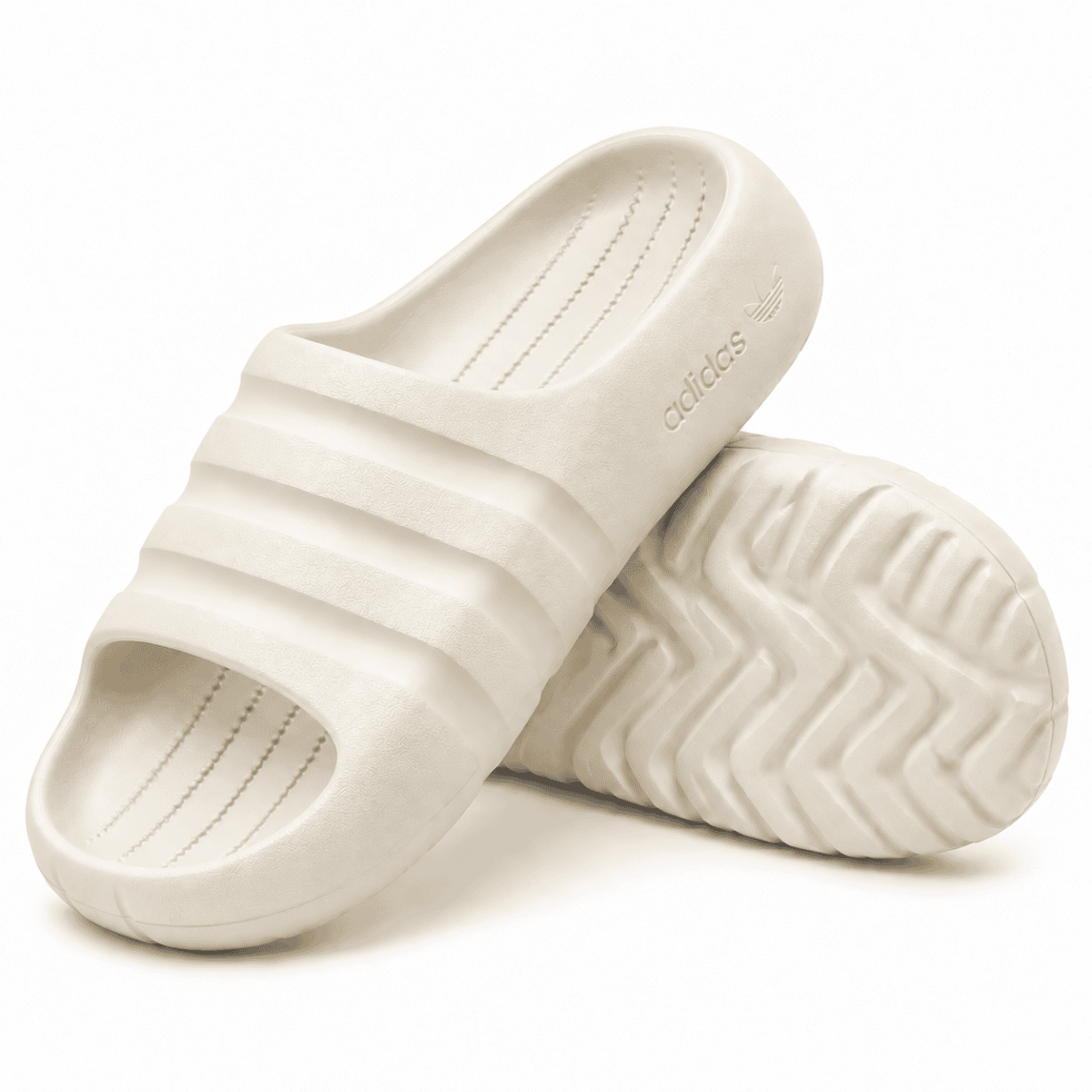 Cream Adidas Adilette Ayoon Slides with Bad Bunny logo on the sole.