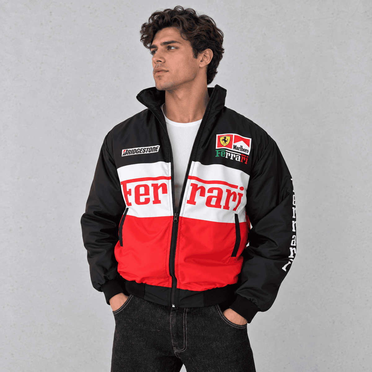 Black and red Ferrari Formula 1 team jacket with sponsor logos.