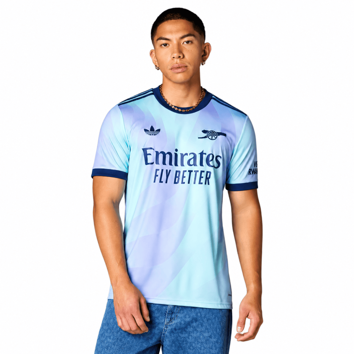 Arsenal third jersey 2024/25 with light blue and dark blue colors, logo visible.