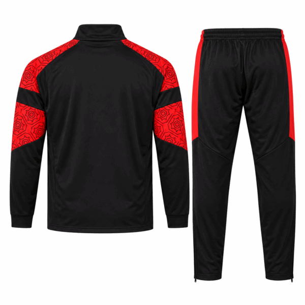 Black and red AC Milan Puma tracksuit set with geometric pattern on shoulders and sleeves.