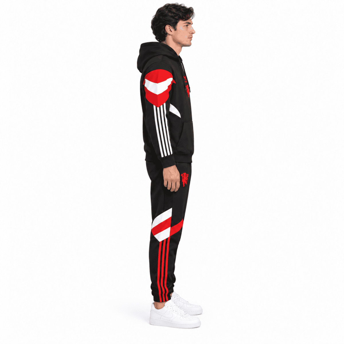Man United hoodie tracksuit in black with red and white accents, full body side view.
