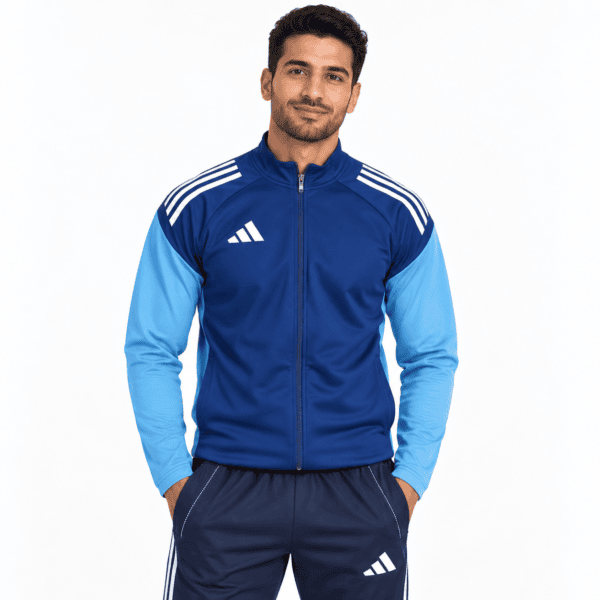 Man in blue and light blue Adidas tracksuit, front view, white background.