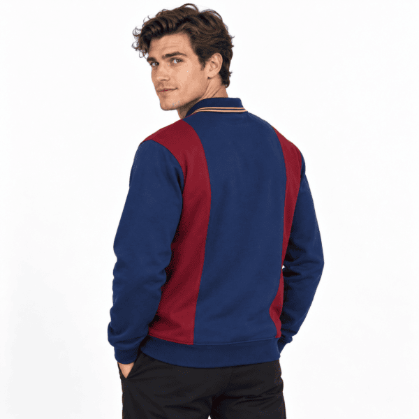 Man wearing a blue and red long sleeve sports jersey, back view.