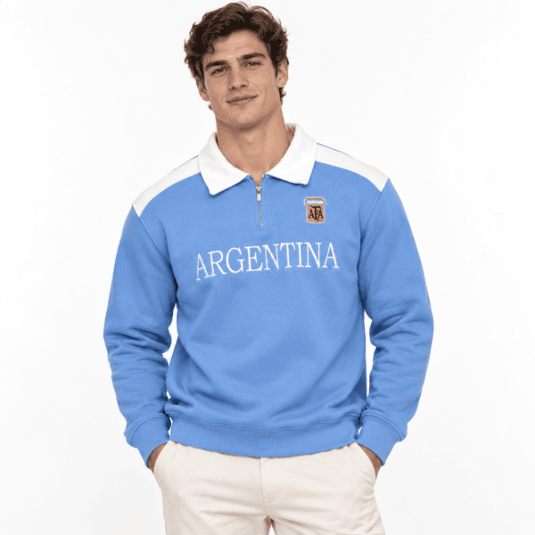 Man wearing Argentina long-sleeve polo with Argentina badge and white collar.