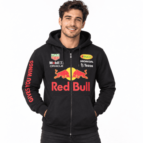Man wearing Black Red Bull hoodie with sponsor logos and Red Bull logo.