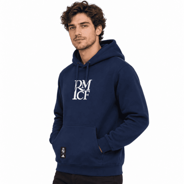 Man wearing navy blue hoodie with white logo, front view, casual style.