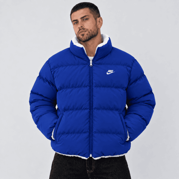 ChatGPT Image Sep 23 2026 07_01_04 PM 1 - UAE SPORT STORE Blue Nike puffer jacket with white lining and logo, men's fashion.