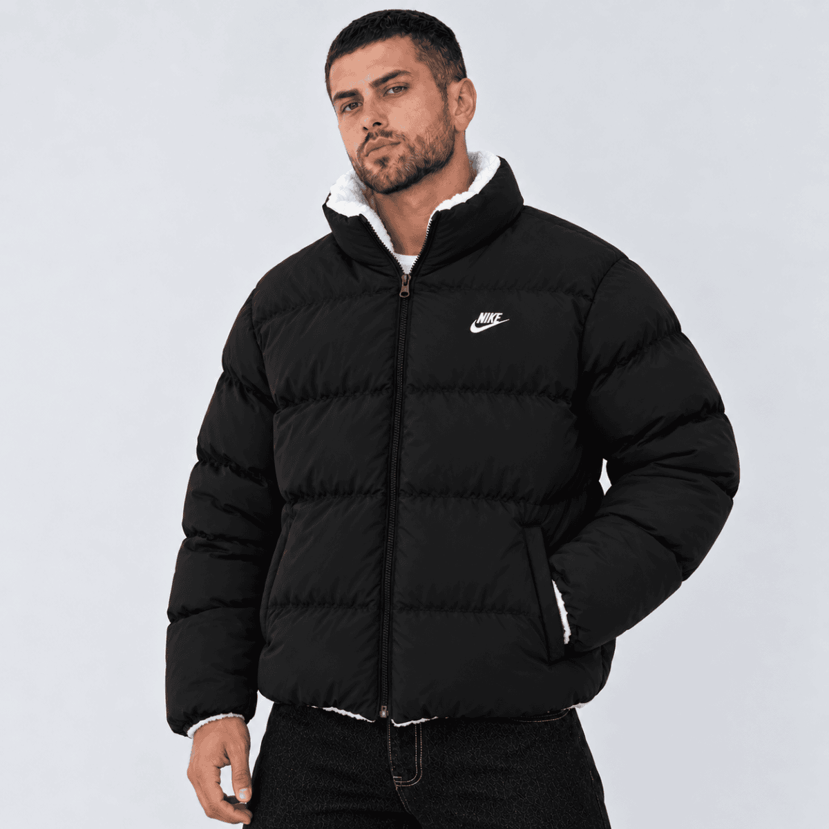 Black Nike puffer jacket with white logo and fleece collar, men's fashion.