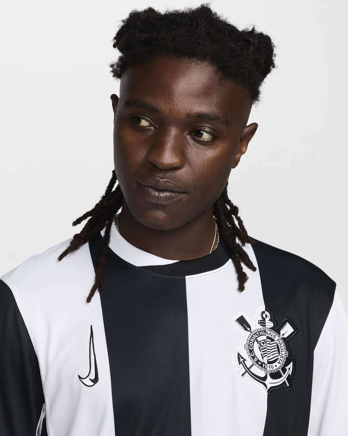 Corinthians home football jersey black and white with club crest and Nike logo.