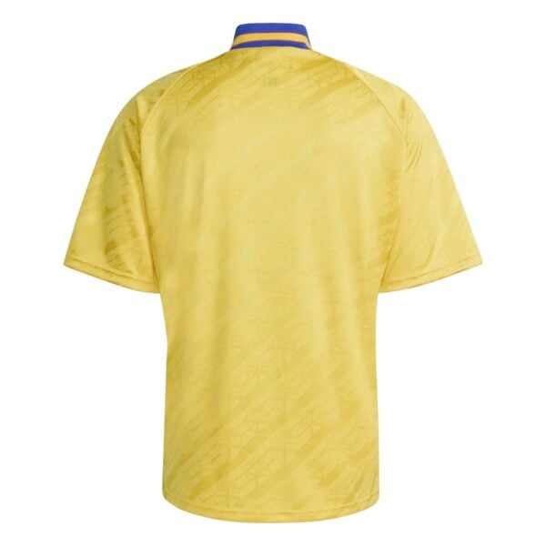 Yellow football jersey with blue and yellow collar, back view.