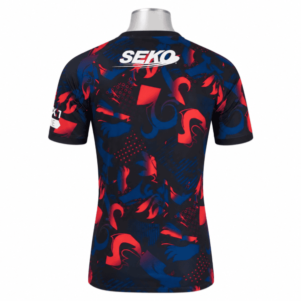 Rangers third jersey 2025/26 with blue and red abstract pattern and sponsor logo.
