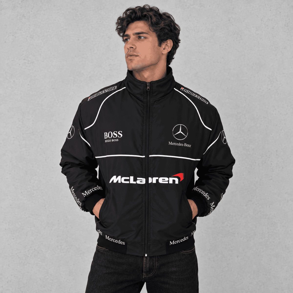 Black McLaren Mercedes Formula 1 team jacket with sponsor logos and white accents.