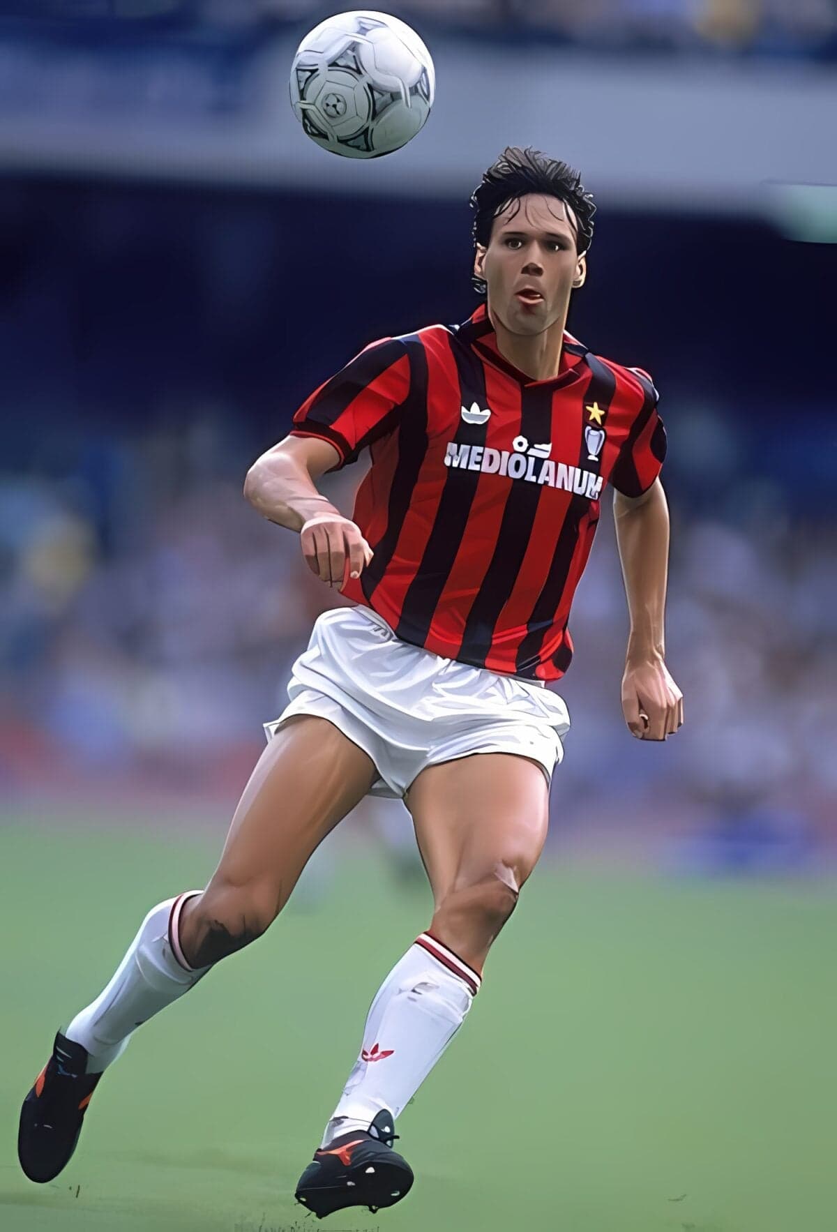 Football player in red and black striped kit chasing ball on field.