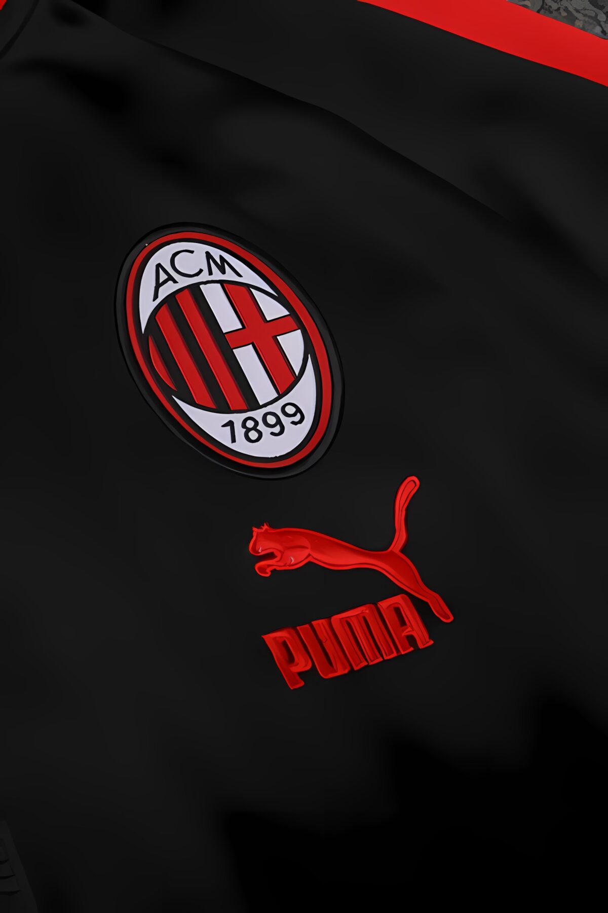 AC Milan football jersey with club crest and Puma logo in black and red.
