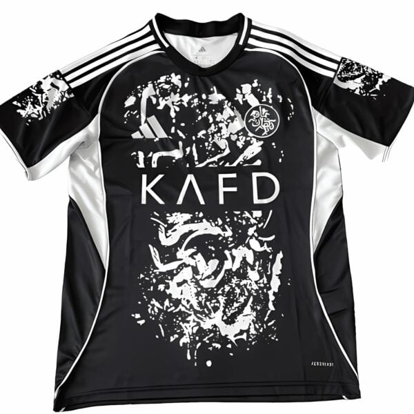 al-nassr-fourth-jersey-2026-main-16210-1 - UAE SPORT STORE Black and white football jersey with graffiti design and KAFD logo.