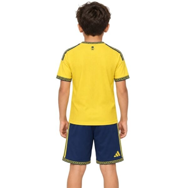 Al Nassr Home Kit Kids 2026/27 back view yellow shirt with navy shorts