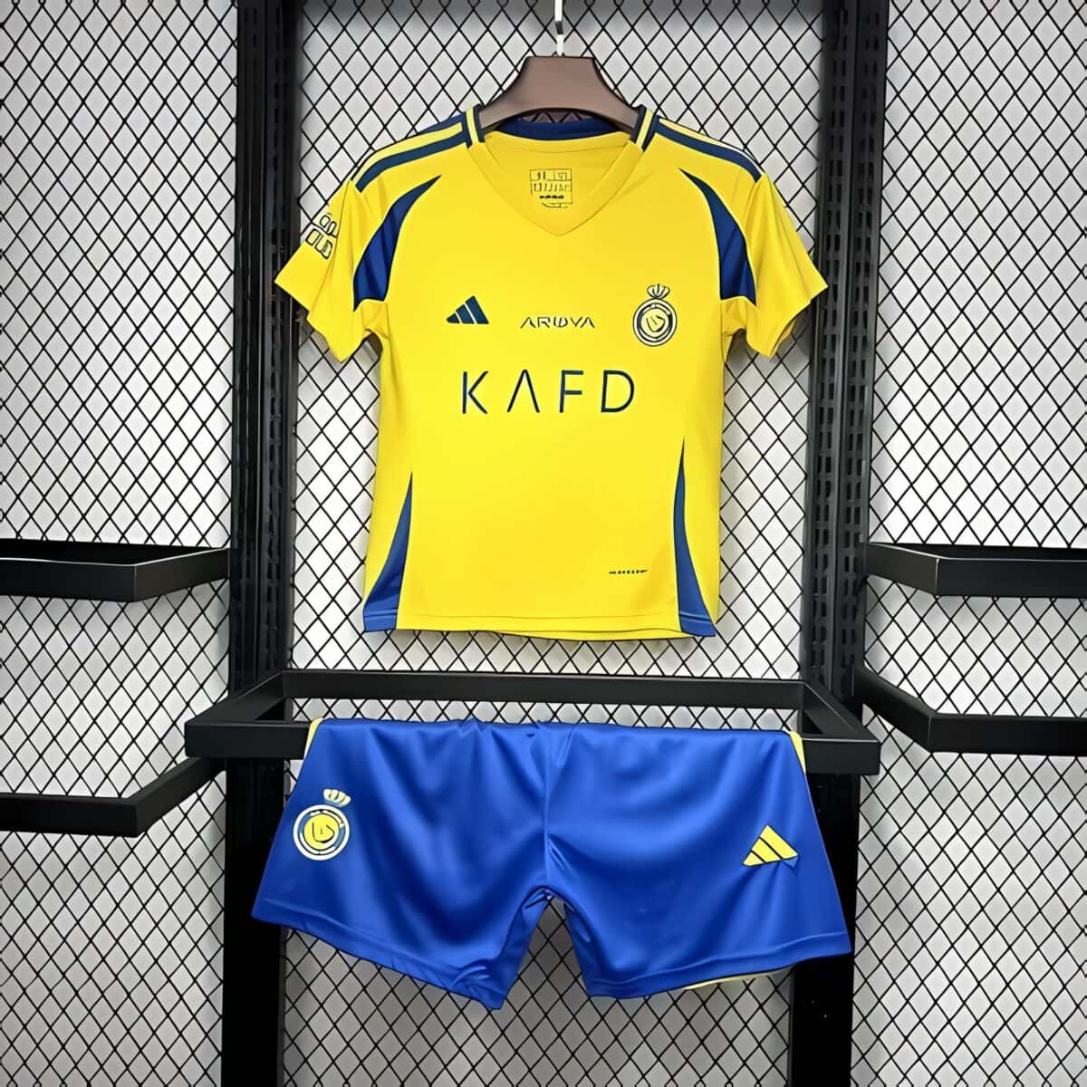 UAE football kit, yellow jersey and blue shorts, club logo, Adidas logo.