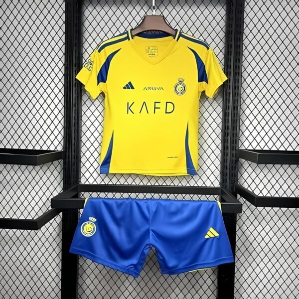 UAE football kit, yellow jersey and blue shorts, club logo, Adidas logo.
