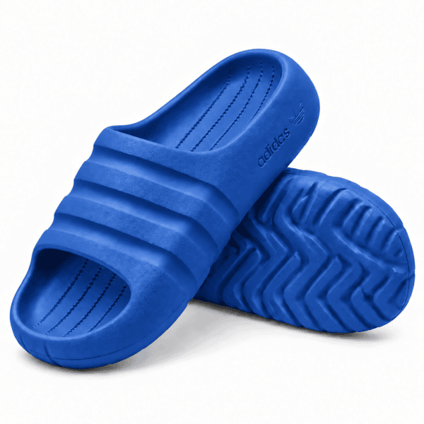 b4999bc2-f7ba-4dd4-b320-114b510dc6aa - UAE SPORT STORE Blue Adidas Adilette Ayoon Slides with Bad Bunny logo on the strap.