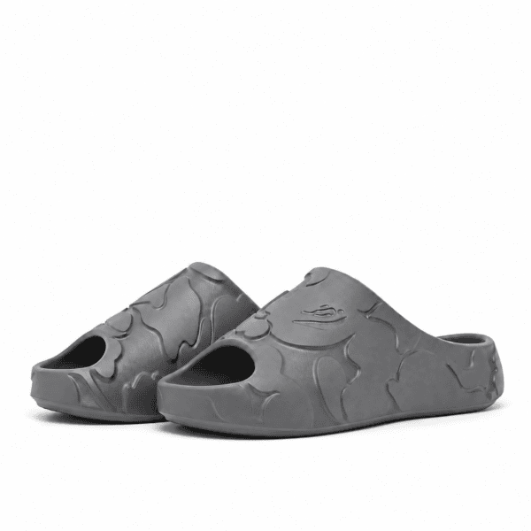Grey Bape Slides with camouflage pattern on a white background.